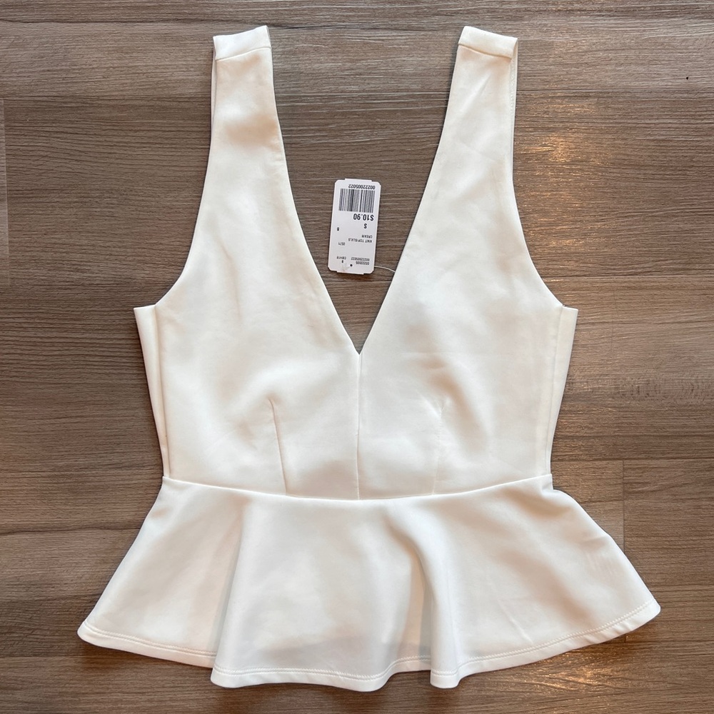 Deep V sleeveless peplum top